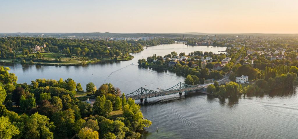 Drone panorama of the Glienicke bridge of spies between Berlin and Potsdam, crossing the havel river. 