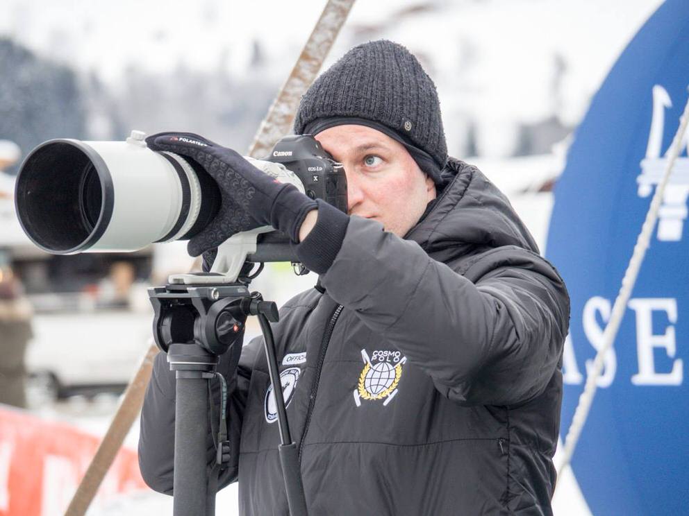 Christian photographing a winter event outdoors with a long telephoto lense